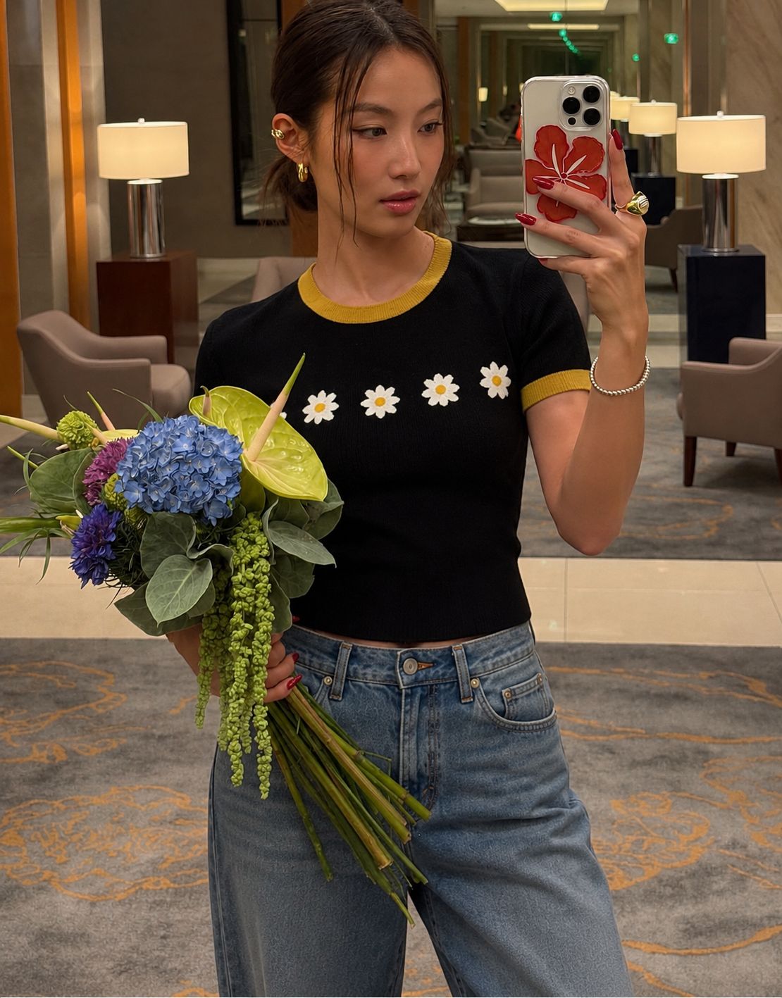Daisy Chain Knit Tee — black knit with white daisies and marigold trim