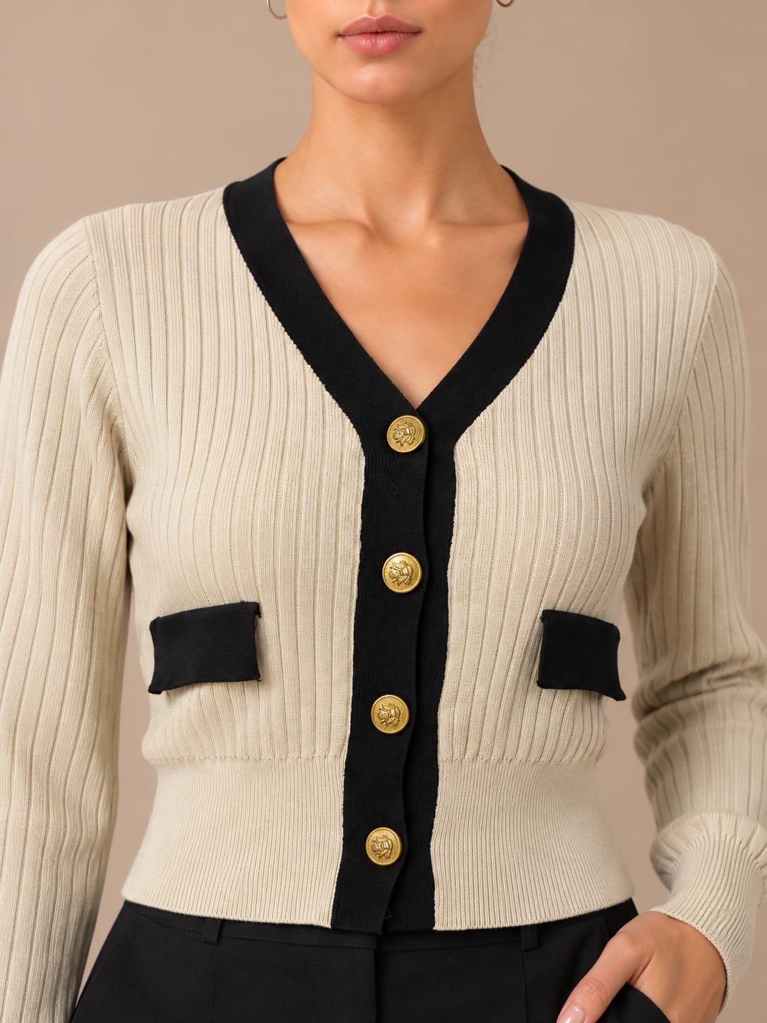 Gold Crest Contrast Cardigan, close view of the antique gold crest buttons