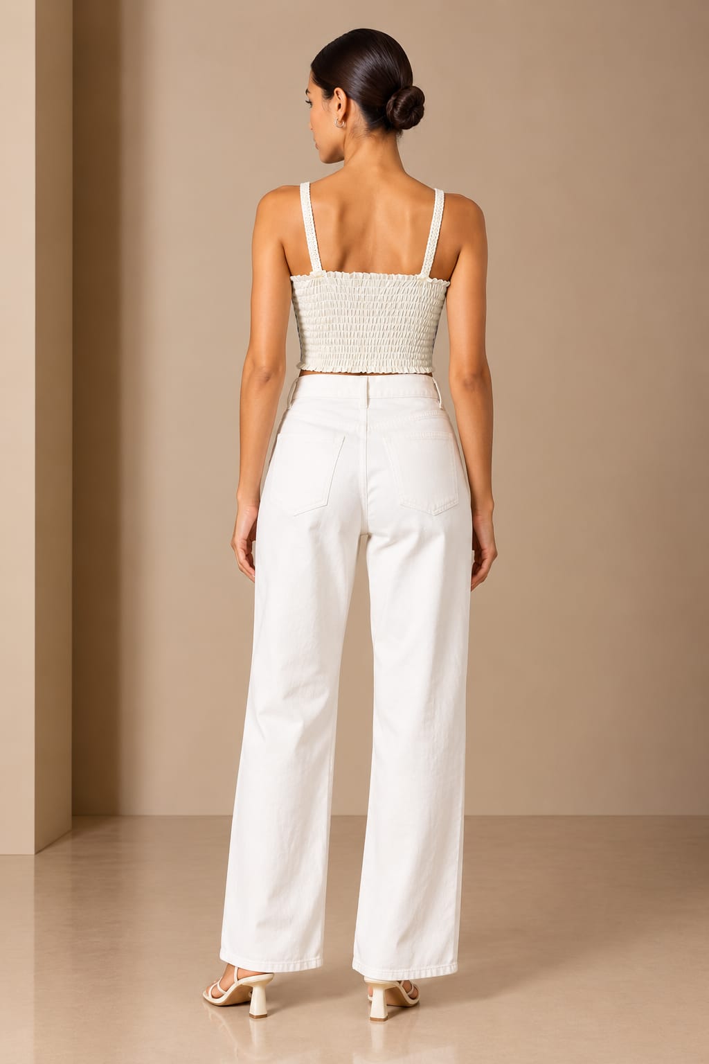 Back view showing the smocked cream panel and crochet straps