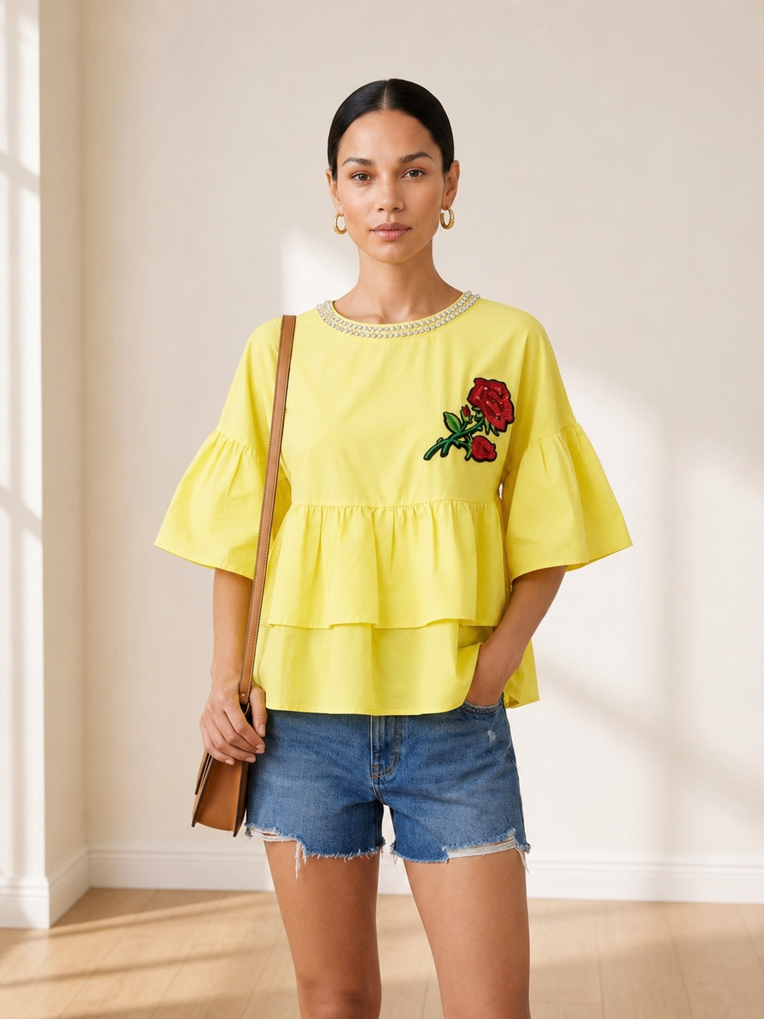 Rosette Tiered Ruffle Top in yellow worn with denim shorts
