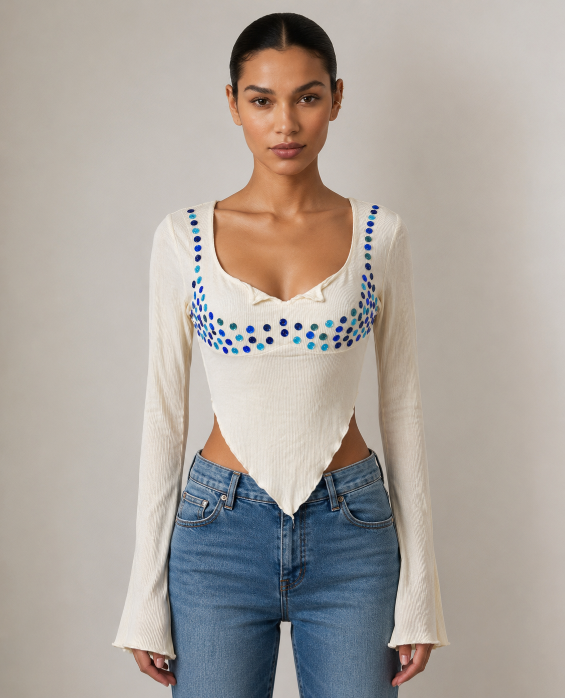 Close detail of the blue mirror discs across the bodice and shoulders
