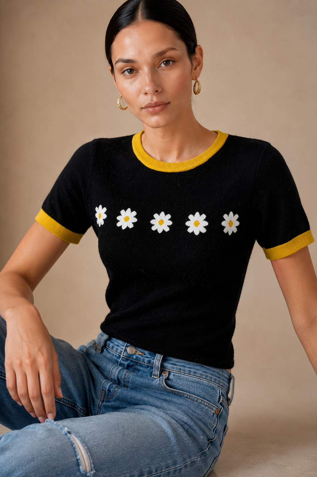Daisy Chain Knit Tee seated, showing fit through the body