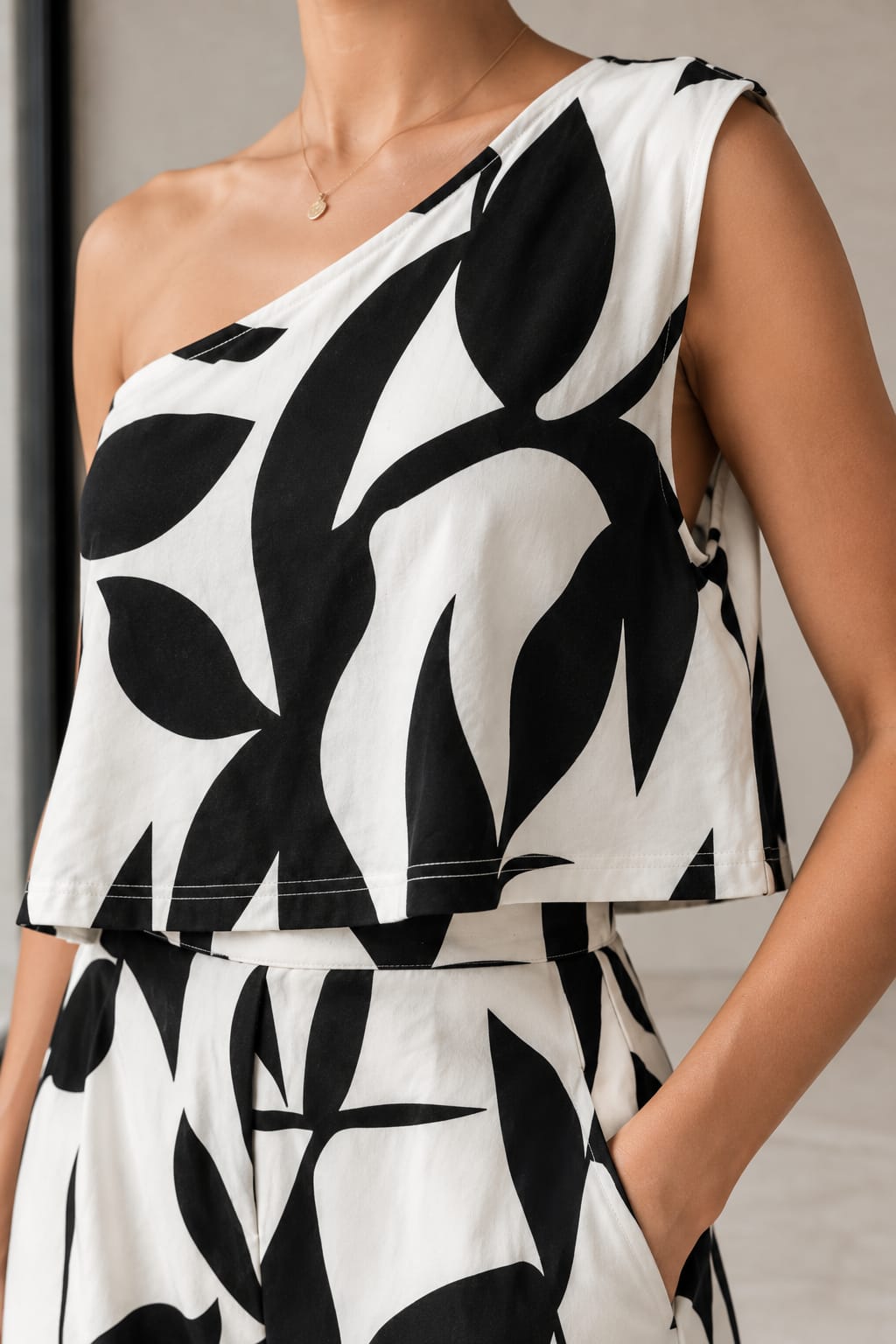 Ink Leaf One-Shoulder Co-ord, close view of the leaf print and contrast topstitch