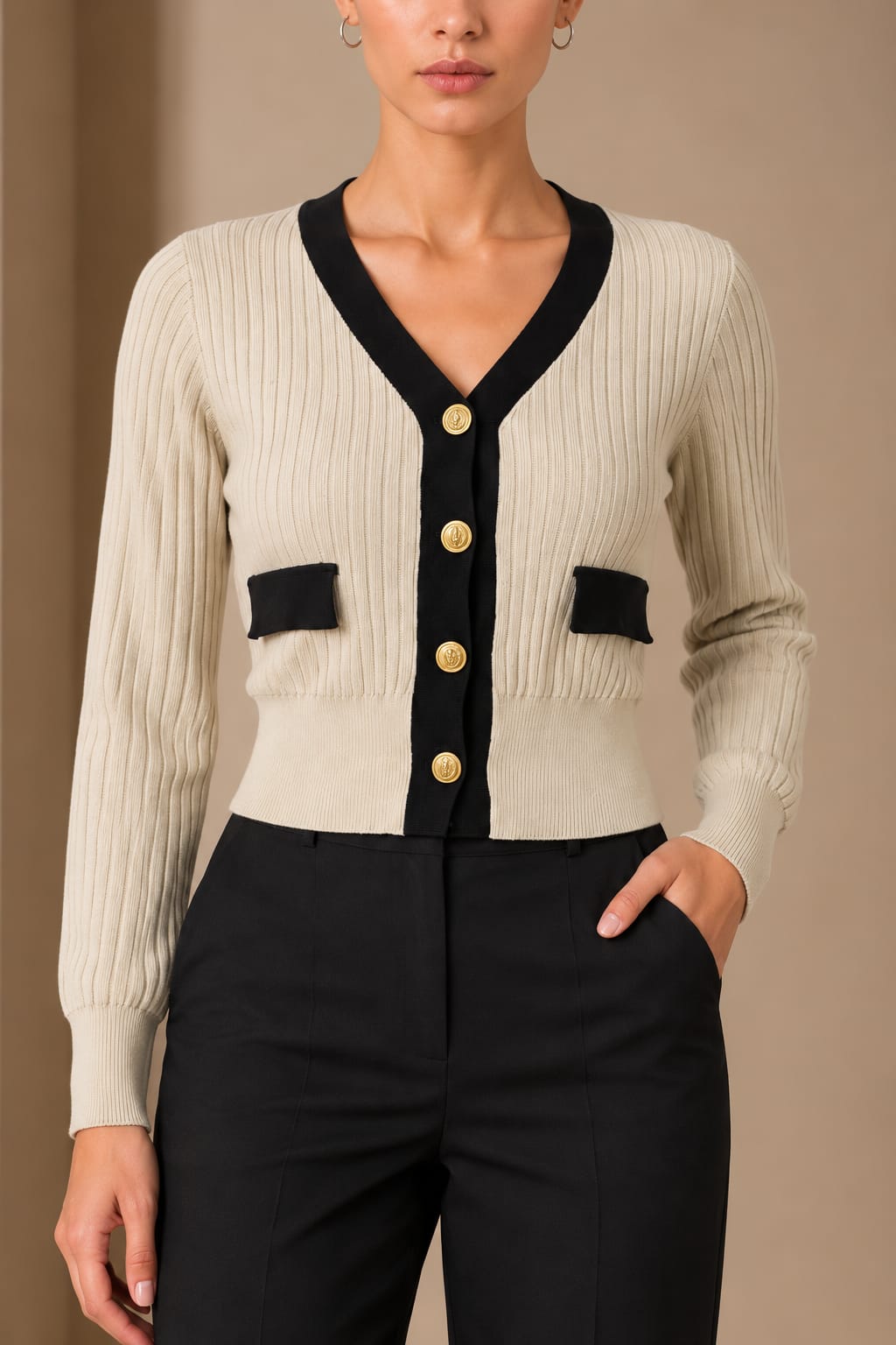 Gold Crest Contrast Cardigan, close view of the black trim and mock pockets