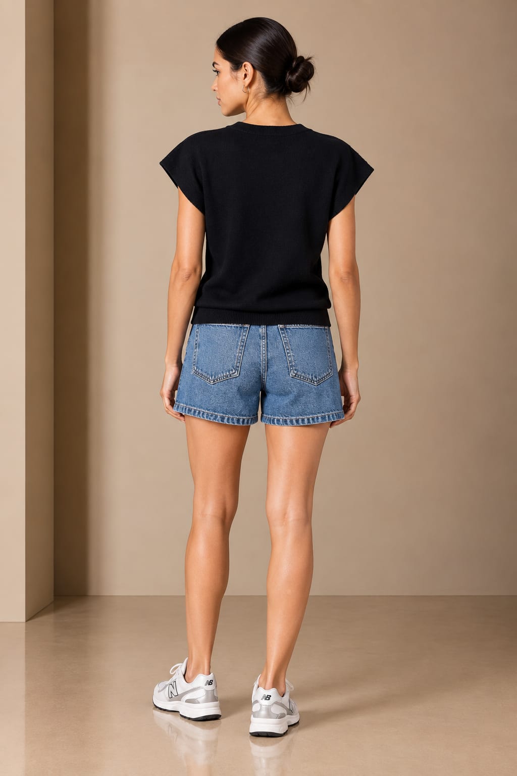 Back view of the black knit top
