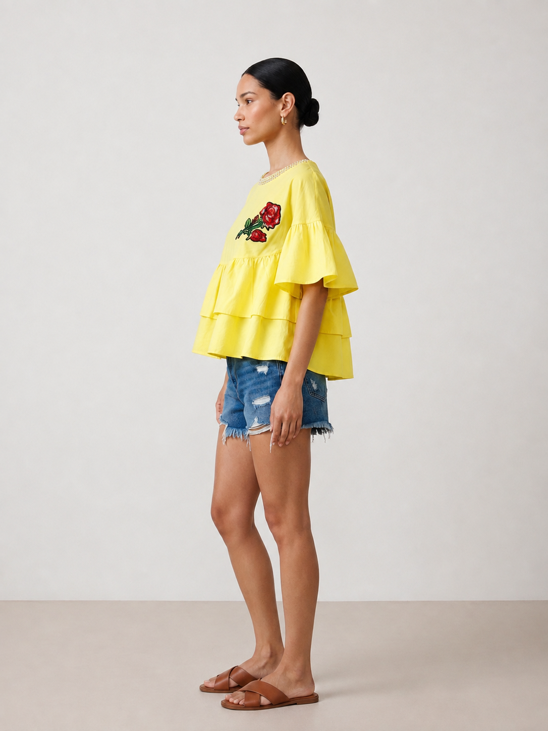 Rosette Tiered Ruffle Top side view showing the tiered volume